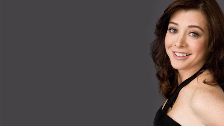 Alyson Hannigan Smiling In Black Dress And Side Pose